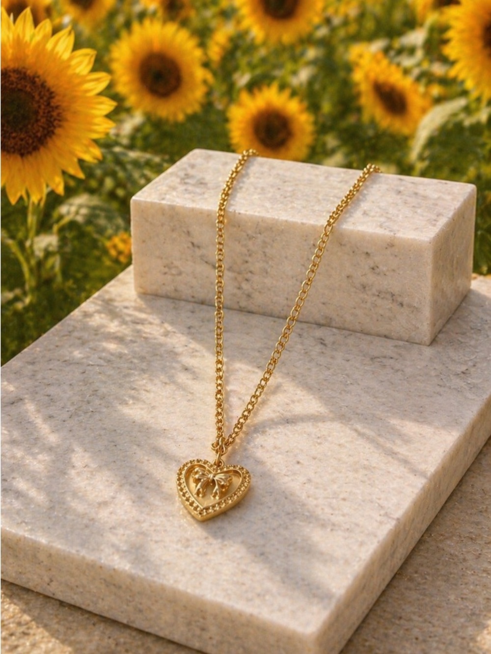Gold Heart Pendant Necklace with Bow Detail
